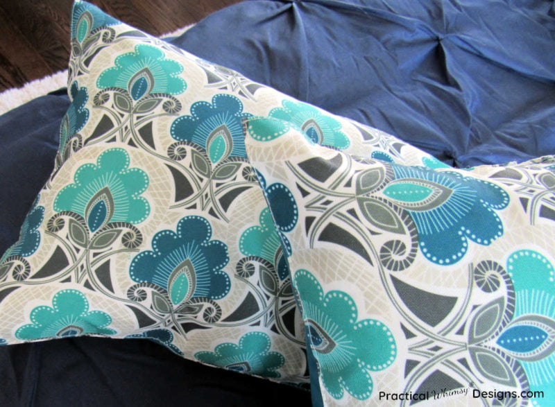 How to make pillows out of placemats: pillows on bed.