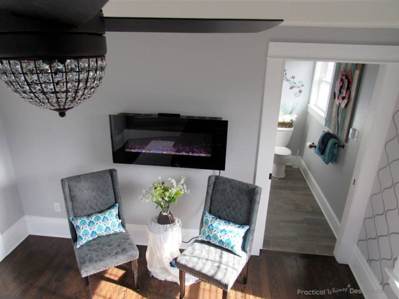 Grey chairs and electric fireplace