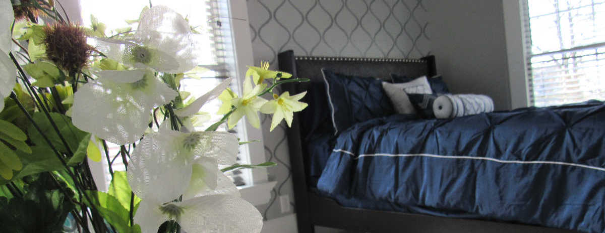 Master bedroom with gray stenciled walls and blue bed: DIY and Home Decor inspiration