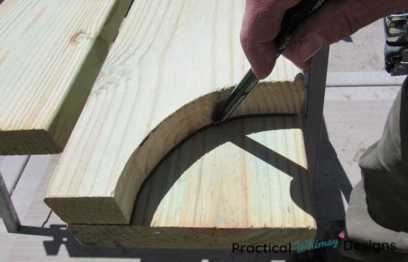Measuring arch on beams for diy wood pergola.