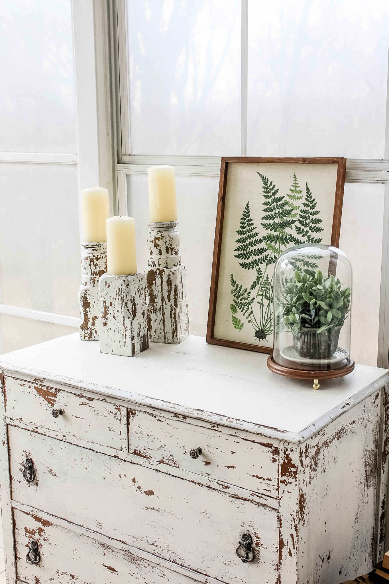 Candlesticks sitting on white dresser