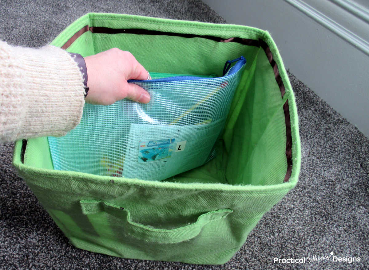 Legos organized in storage bag and fabric bin