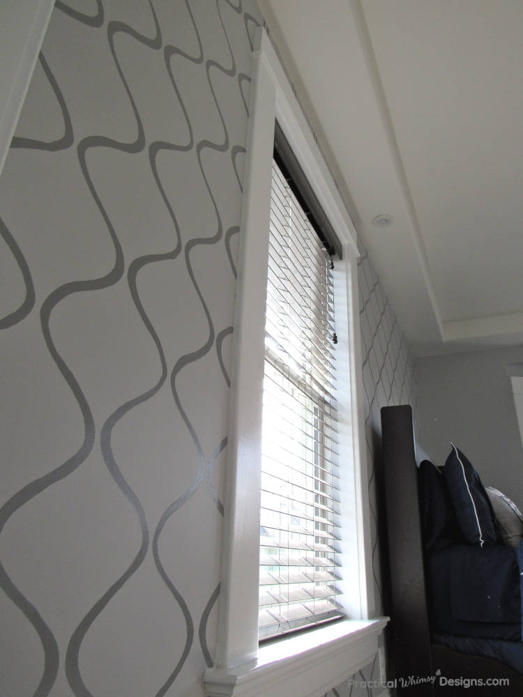 Stenciled accent wall in master bedroom.