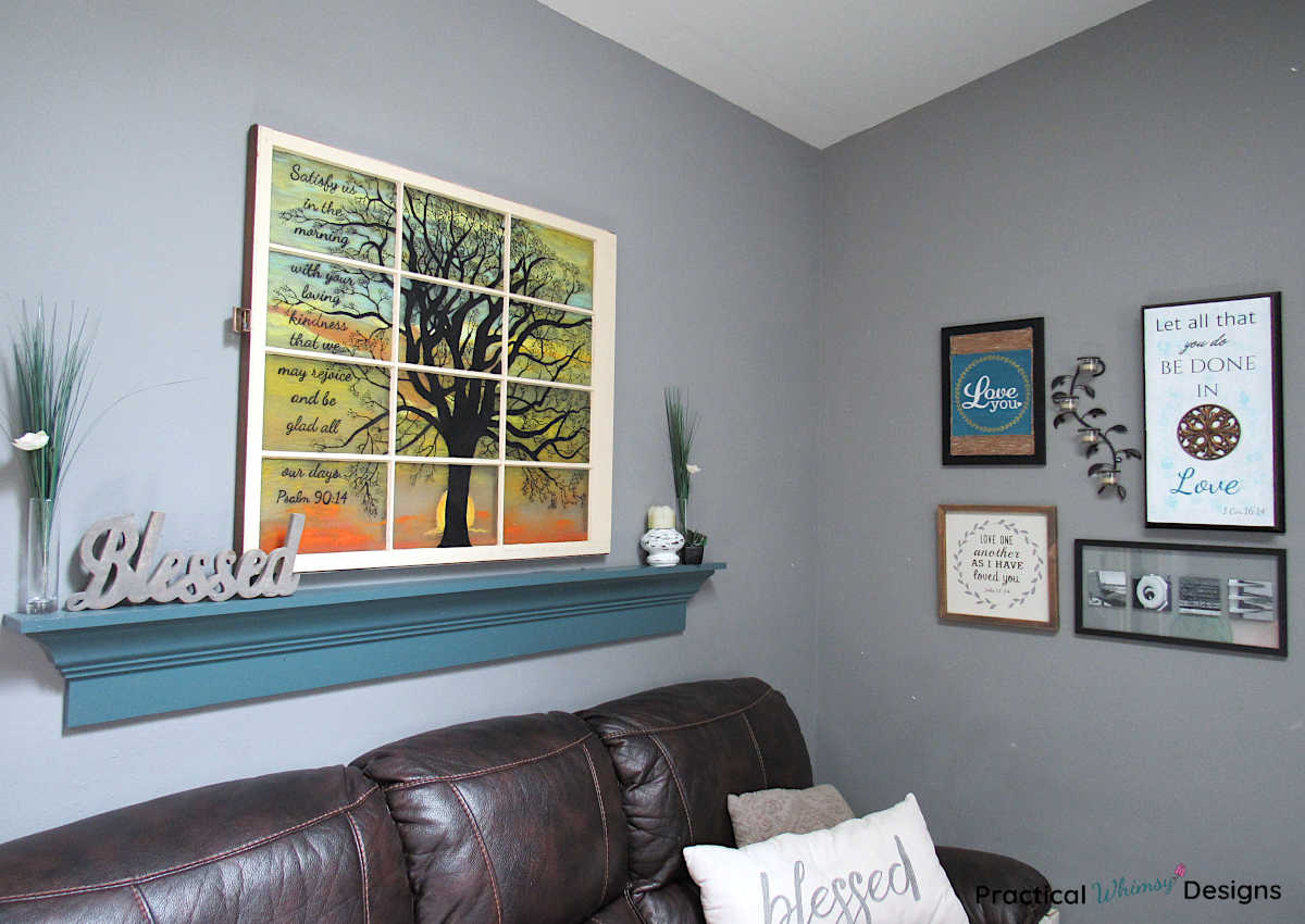 Wooden shelf and faux stained glass window art in family room
