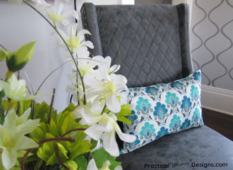 Pillow on chair in master bedroom.