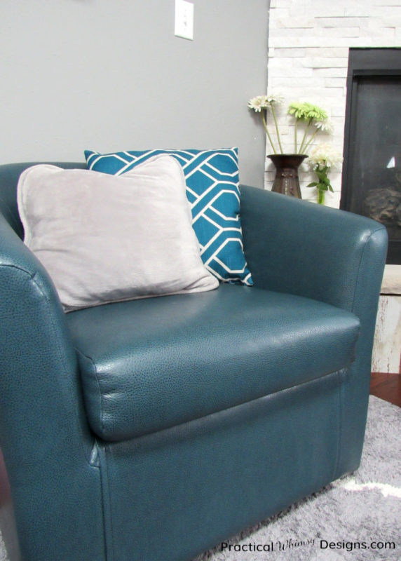 Decorative pillows on blue chair