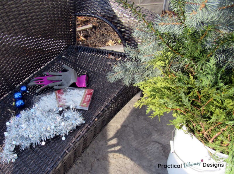 Pine boughs and supplies for making a winter porch pot