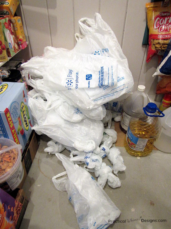 Plastic bags piled on pantry floor