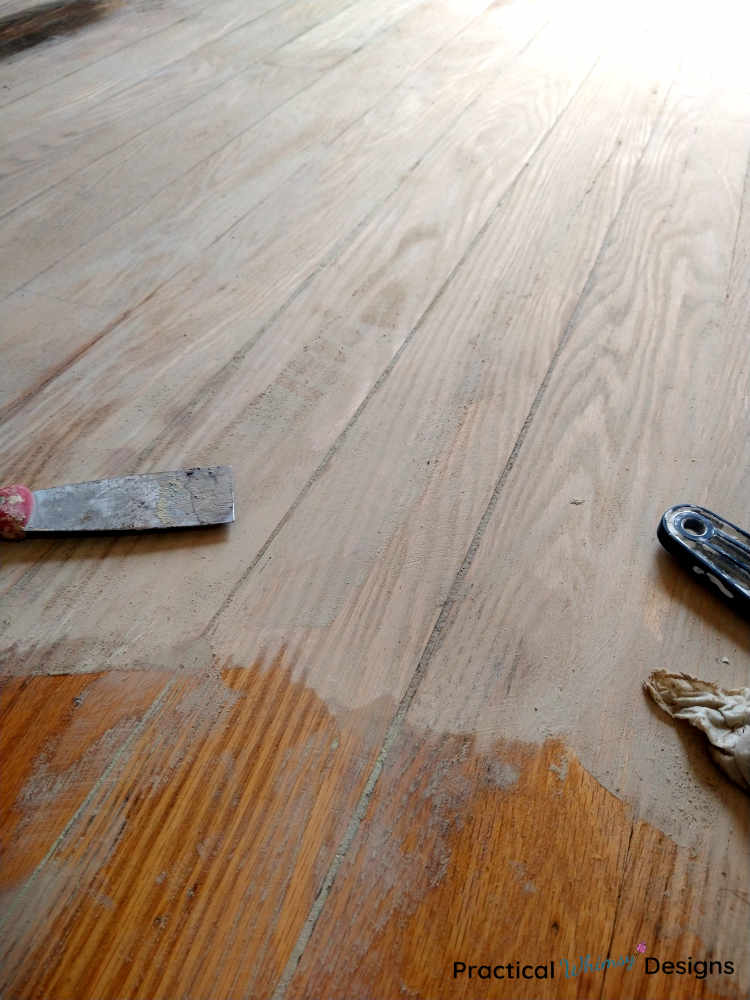 Hardwood flooring with wood filler spread on it.