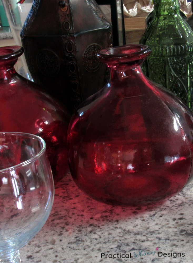 Red, green, and brown vases