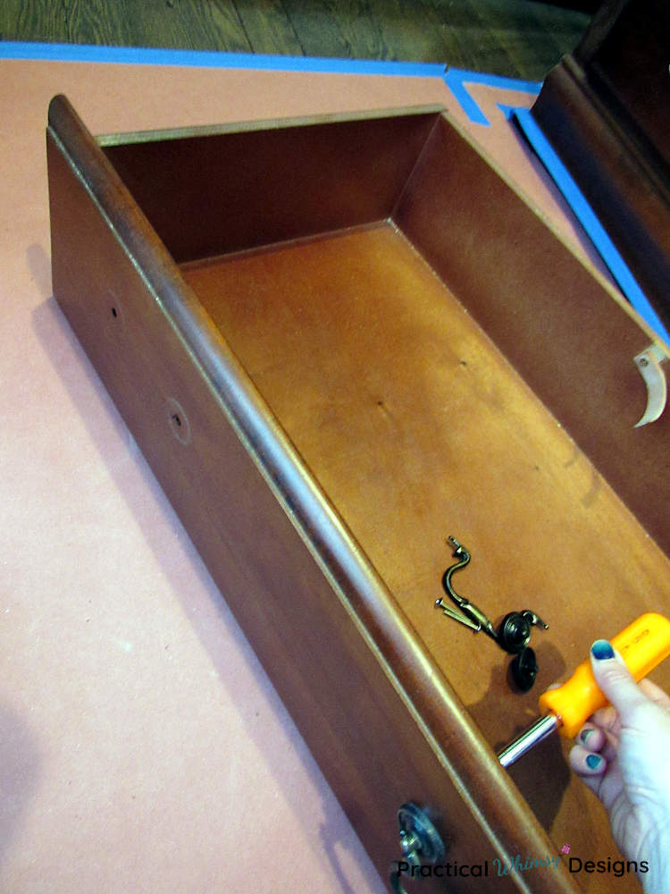 Removing handles form dresser drawer.