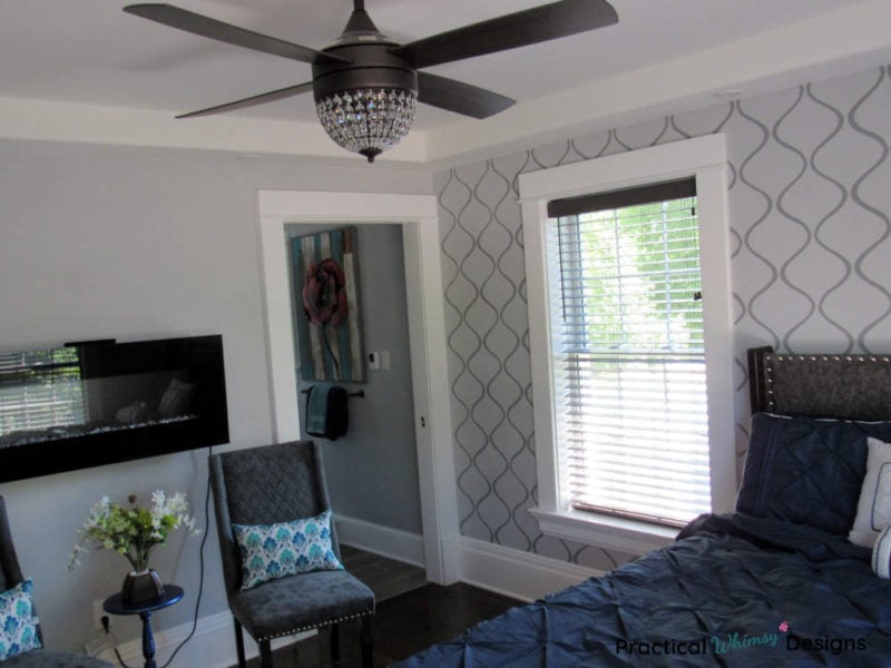 Master bedroom with wall stencil on accent wall