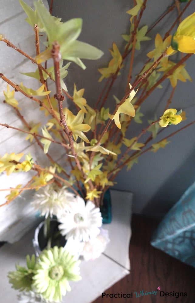 Spring branch decor with yellow flowers