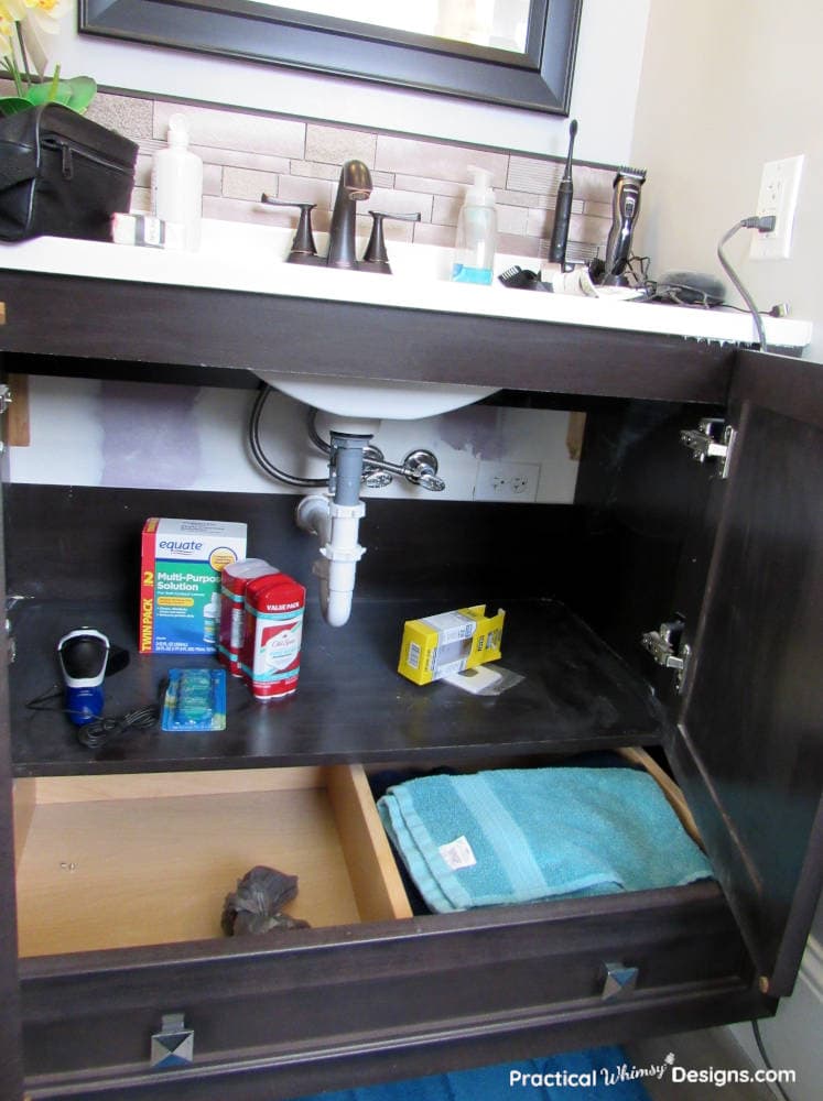 Sink cabinet before organization: his.