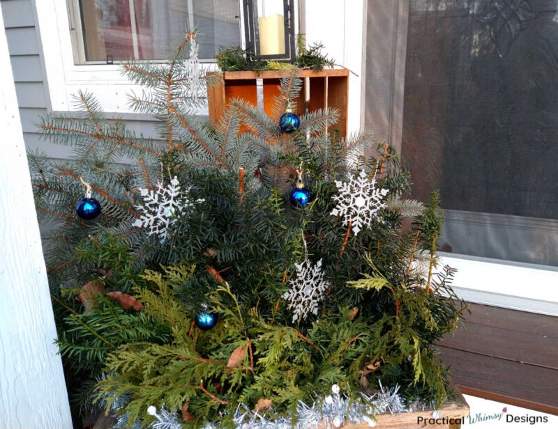 Winter snowflake porch pot on stepsot