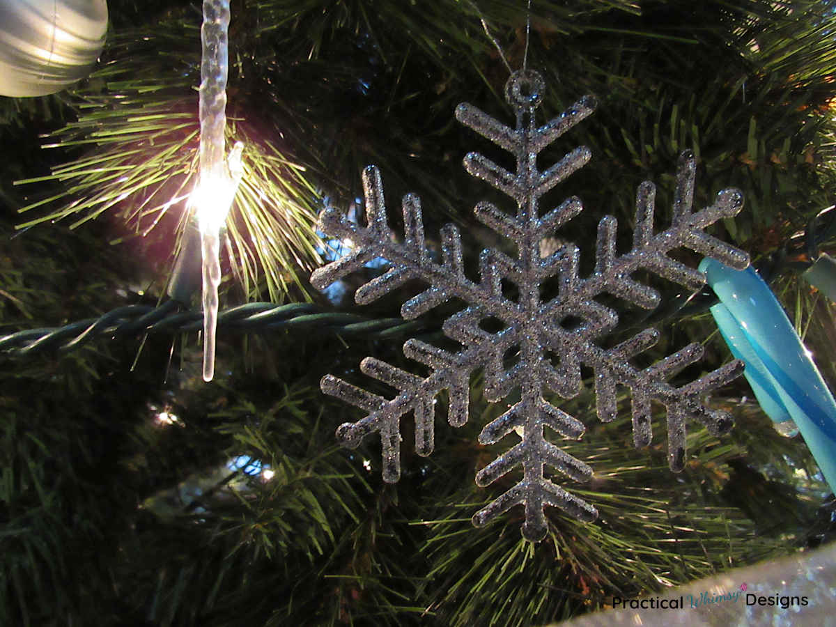 Snowflake ornament on tree