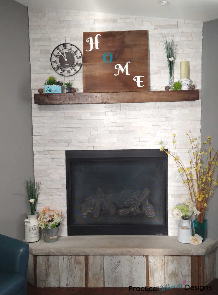 Stacked stone fireplace with spring decor