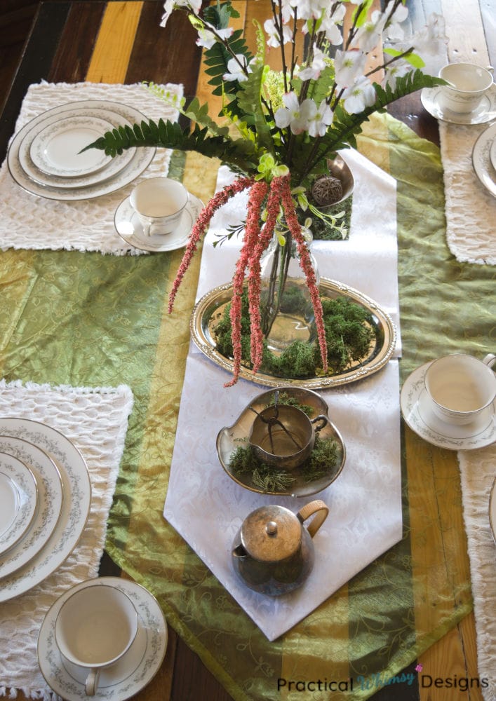 Spring vintage tablescape with flowers and white china