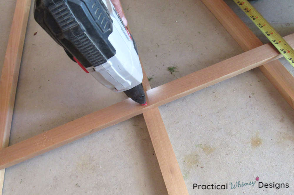 Stapling trellis boards together with a crown stapler.