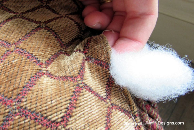 Stuffing Polyester fiberfill back into the pillow