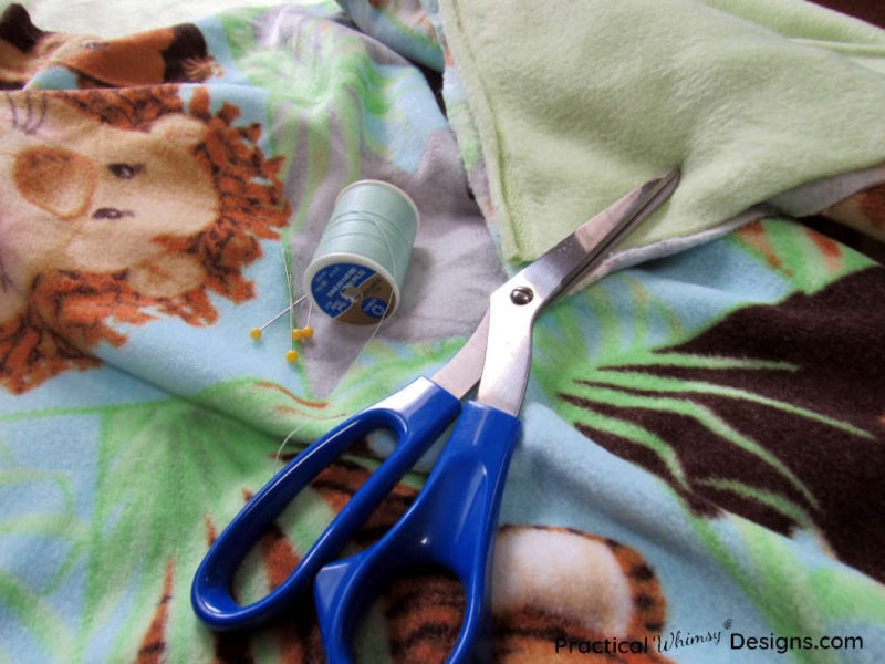 Supplies for how to make a fleece blanket