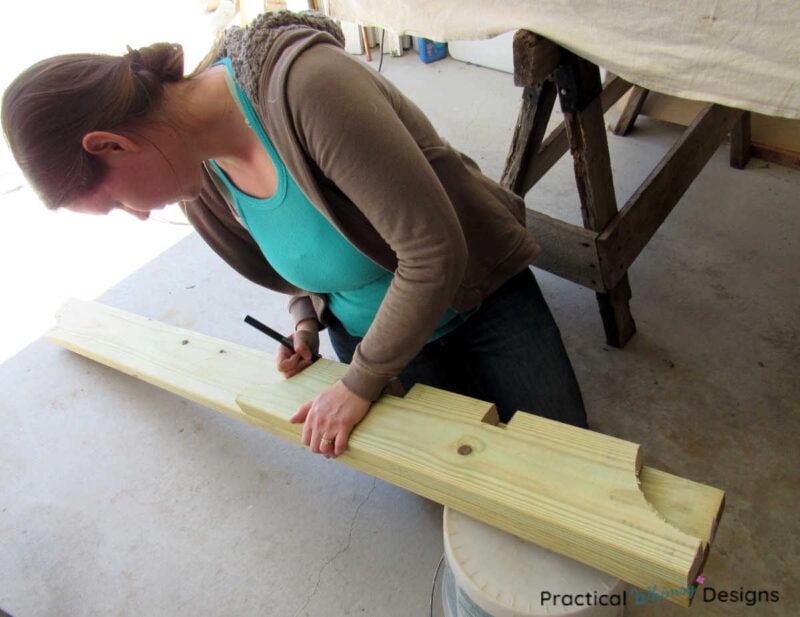 Transferring pattern of pergola rafter onto board for cutting.