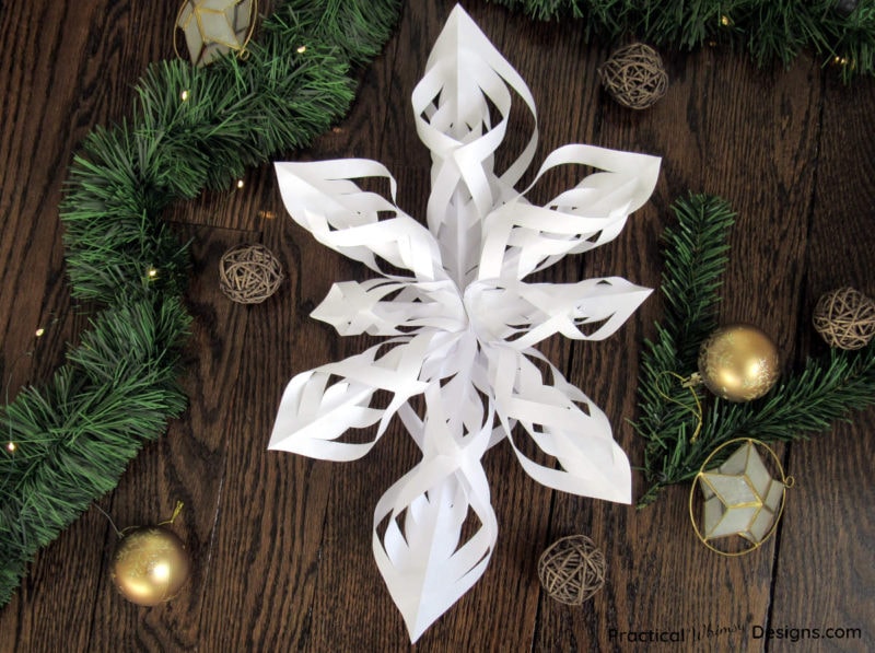 Twisted Paper Star on wood floor