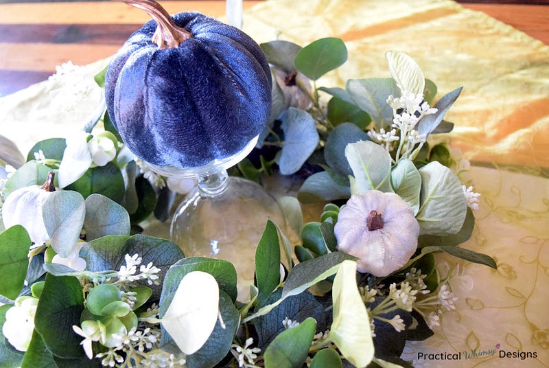 Blue pumpkins and green wreath fall centerpiece.