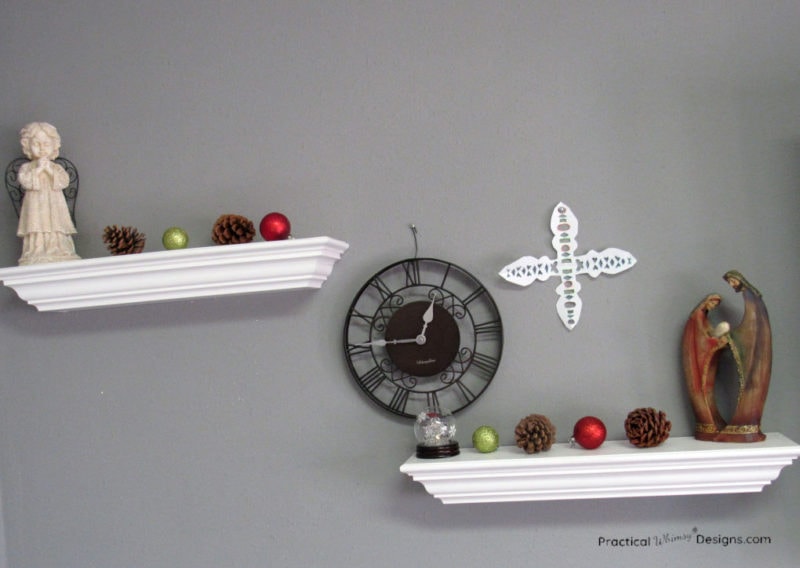 White shelves with ornaments and pinecones