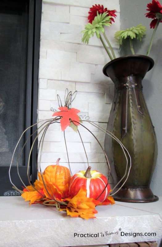 Wire pumpkin on mantel