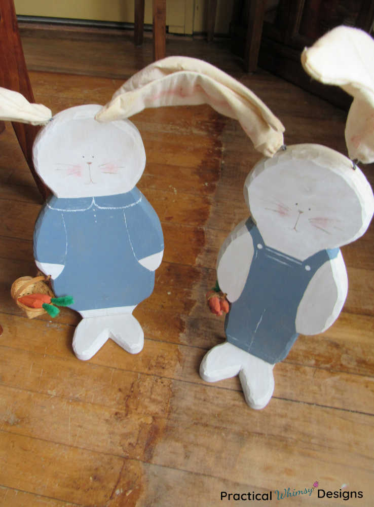 Large wooden bunny decor with blue painted clothes