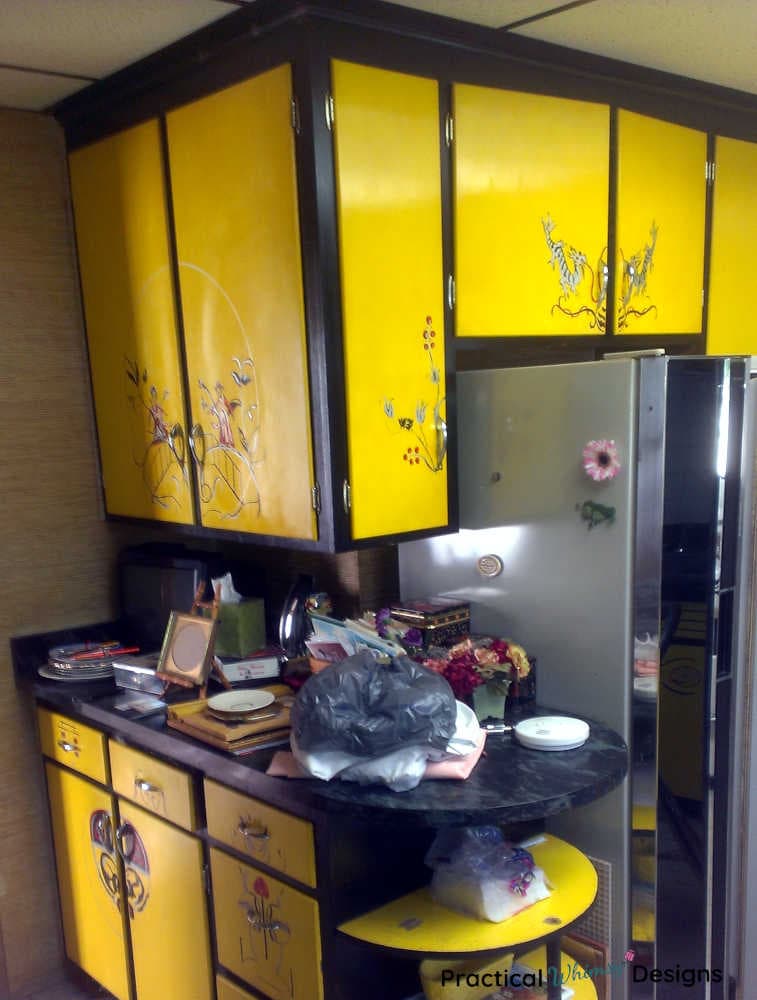 Lemon yellow and black oriental cabinets in kitchen