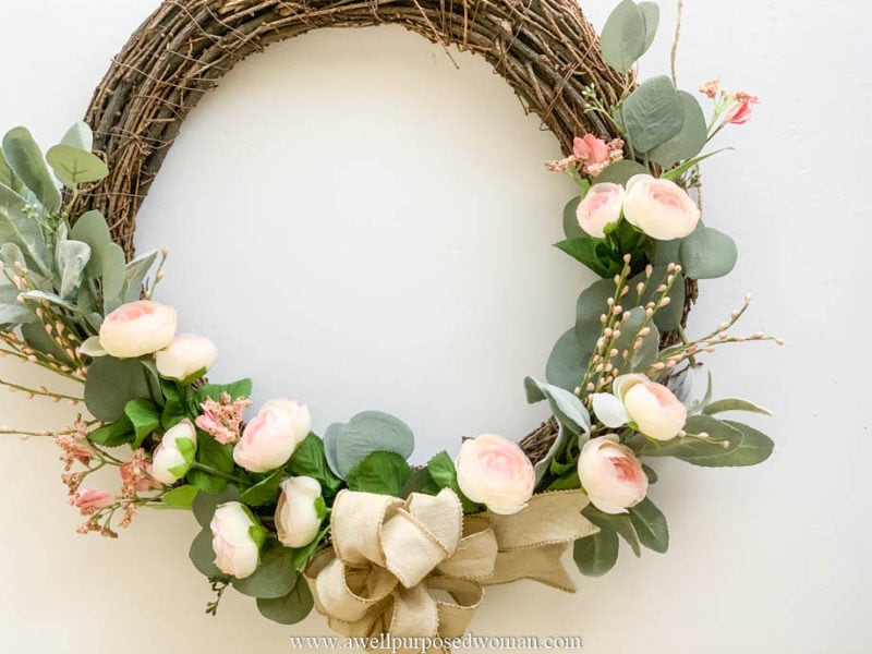 Spring grapevine wreath with pink flowers