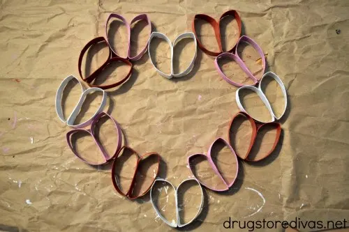 Red, white, and pink toilet paper roll wreath Valentines day craft.